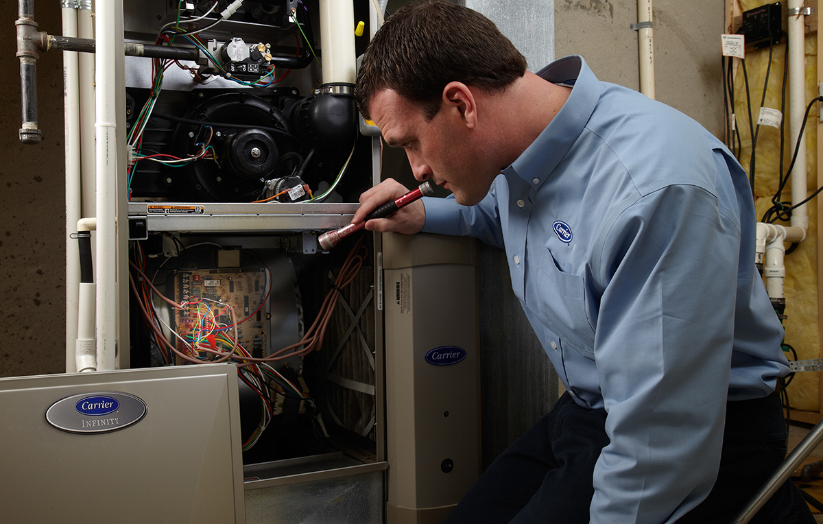 Emergency HVAC Repair, Image 2 a-carrier-dealer-performs-hvac-emergency-repair-on-furnace